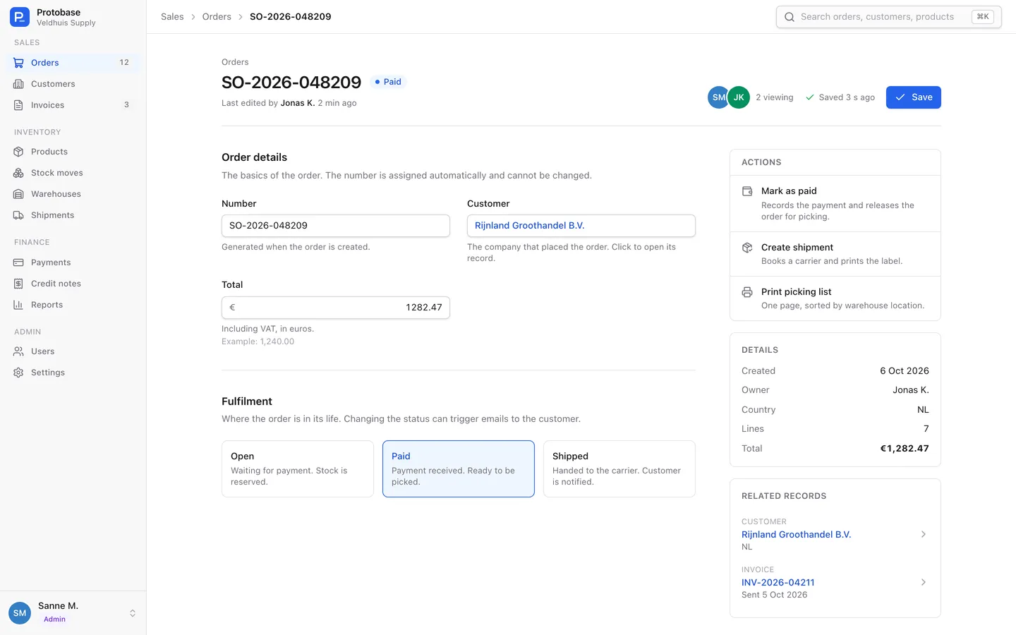 An order record generated from the order config, with a read-only number, a customer link, the total and a status choice.